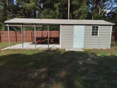 Don't miss this one! Beautifully shaded, freshly painted, well on Wildwood Country Club in Florida - for sale on GolfHomes.com, golf home, golf lot