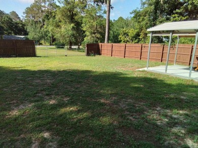 Don't miss this one! Beautifully shaded, freshly painted, well on Wildwood Country Club in Florida - for sale on GolfHomes.com, golf home, golf lot