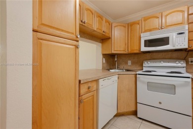 Beautiful apartment with lake front view in the lovely Pine on Pine Island Ridge Country Club in Florida - for sale on GolfHomes.com, golf home, golf lot