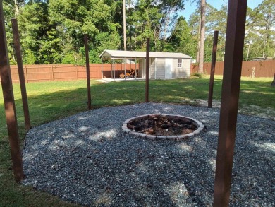 Don't miss this one! Beautifully shaded, freshly painted, well on Wildwood Country Club in Florida - for sale on GolfHomes.com, golf home, golf lot