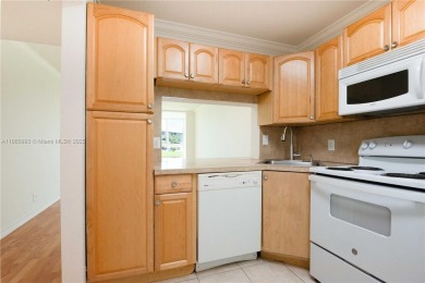 Beautiful apartment with lake front view in the lovely Pine on Pine Island Ridge Country Club in Florida - for sale on GolfHomes.com, golf home, golf lot