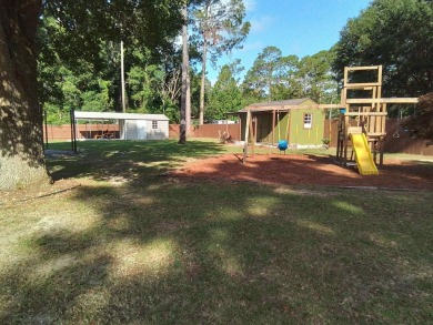 Don't miss this one! Beautifully shaded, freshly painted, well on Wildwood Country Club in Florida - for sale on GolfHomes.com, golf home, golf lot
