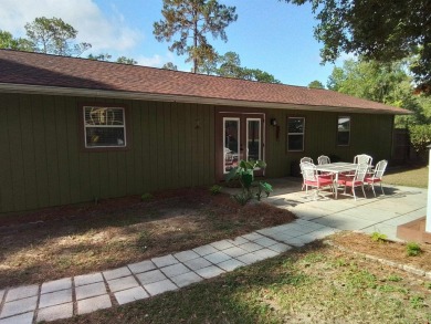 Don't miss this one! Beautifully shaded, freshly painted, well on Wildwood Country Club in Florida - for sale on GolfHomes.com, golf home, golf lot