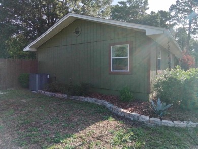Don't miss this one! Beautifully shaded, freshly painted, well on Wildwood Country Club in Florida - for sale on GolfHomes.com, golf home, golf lot