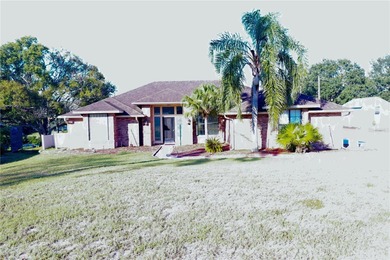 Welcome to this beautiful golf-front brick 3-bedroom, 2-bath on Deltona Golf Club in Florida - for sale on GolfHomes.com, golf home, golf lot