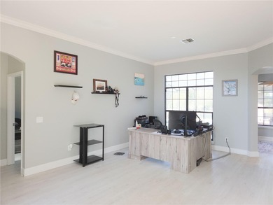 Welcome to this beautiful golf-front brick 3-bedroom, 2-bath on Deltona Golf Club in Florida - for sale on GolfHomes.com, golf home, golf lot