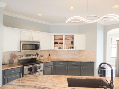 Welcome to this beautiful golf-front brick 3-bedroom, 2-bath on Deltona Golf Club in Florida - for sale on GolfHomes.com, golf home, golf lot