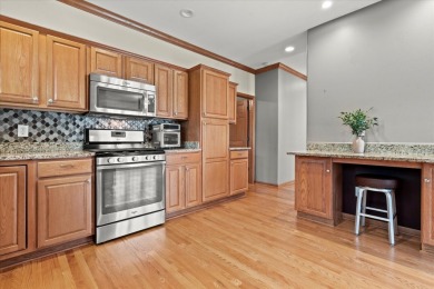 Enjoy gorgeous views in this impressive condo on the 13th hole on Meadowbrook Country Club in Wisconsin - for sale on GolfHomes.com, golf home, golf lot