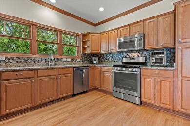 Enjoy gorgeous views in this impressive condo on the 13th hole on Meadowbrook Country Club in Wisconsin - for sale on GolfHomes.com, golf home, golf lot