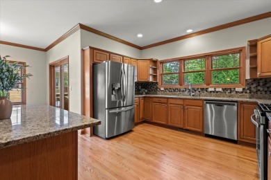 Enjoy gorgeous views in this impressive condo on the 13th hole on Meadowbrook Country Club in Wisconsin - for sale on GolfHomes.com, golf home, golf lot