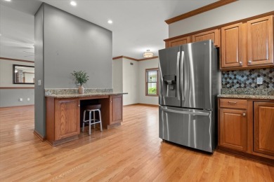 Enjoy gorgeous views in this impressive condo on the 13th hole on Meadowbrook Country Club in Wisconsin - for sale on GolfHomes.com, golf home, golf lot