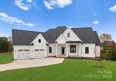 This exquisite new construction home, set on over half an acre on Deer Brook Golf Club in North Carolina - for sale on GolfHomes.com, golf home, golf lot