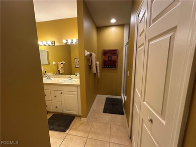 This 2nd-floor end-unit condo is shaded by mature trees and on Westminster Golf Club in Florida - for sale on GolfHomes.com, golf home, golf lot