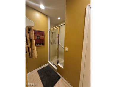 This 2nd-floor end-unit condo is shaded by mature trees and on Westminster Golf Club in Florida - for sale on GolfHomes.com, golf home, golf lot