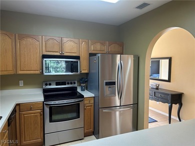 This 2nd-floor end-unit condo is shaded by mature trees and on Westminster Golf Club in Florida - for sale on GolfHomes.com, golf home, golf lot