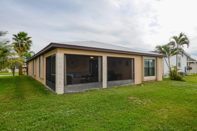 Very solid concrete block home with metal roof and accordion on Spanish Lakes I in Florida - for sale on GolfHomes.com, golf home, golf lot