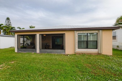 Very solid concrete block home with metal roof and accordion on Spanish Lakes I in Florida - for sale on GolfHomes.com, golf home, golf lot