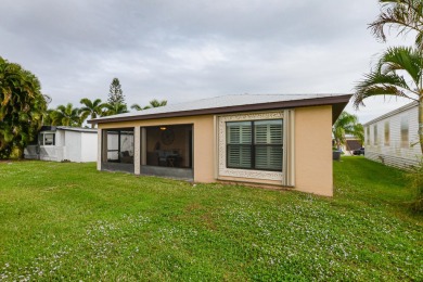 Very solid concrete block home with metal roof and accordion on Spanish Lakes I in Florida - for sale on GolfHomes.com, golf home, golf lot