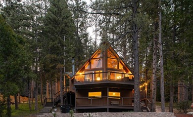 Set across from the golf course, this updated prow-front cabin on Lake Arrowhead Country Club in California - for sale on GolfHomes.com, golf home, golf lot