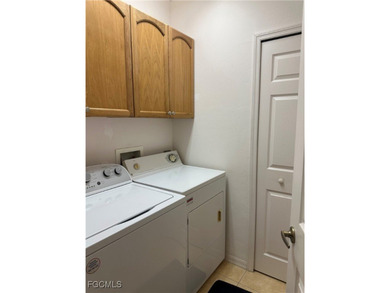 This 2nd-floor end-unit condo is shaded by mature trees and on Westminster Golf Club in Florida - for sale on GolfHomes.com, golf home, golf lot