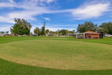 Very solid concrete block home with metal roof and accordion on Spanish Lakes I in Florida - for sale on GolfHomes.com, golf home, golf lot