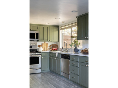 Set across from the golf course, this updated prow-front cabin on Lake Arrowhead Country Club in California - for sale on GolfHomes.com, golf home, golf lot