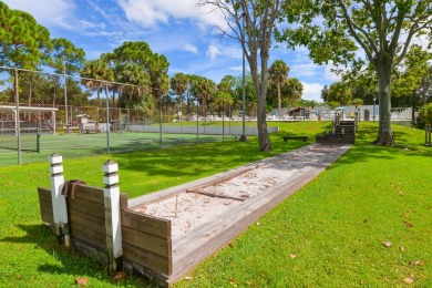 Very solid concrete block home with metal roof and accordion on Spanish Lakes I in Florida - for sale on GolfHomes.com, golf home, golf lot