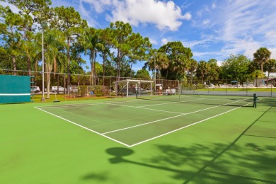 Very solid concrete block home with metal roof and accordion on Spanish Lakes I in Florida - for sale on GolfHomes.com, golf home, golf lot