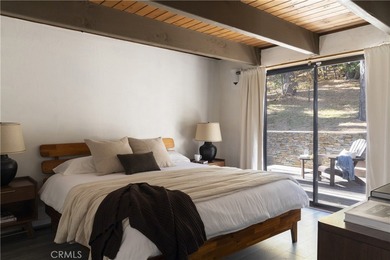 Set across from the golf course, this updated prow-front cabin on Lake Arrowhead Country Club in California - for sale on GolfHomes.com, golf home, golf lot