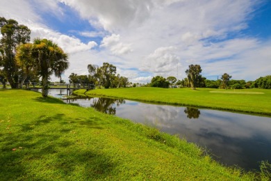 Very solid concrete block home with metal roof and accordion on Spanish Lakes I in Florida - for sale on GolfHomes.com, golf home, golf lot