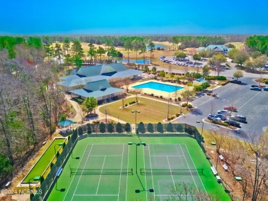 Wooded lot overlooking the 4th Fairway of the Heron course on Carolina National Golf Club in North Carolina - for sale on GolfHomes.com, golf home, golf lot