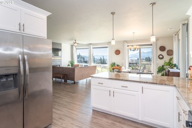 Experience gorgeous sunset views overlooking the 17th hole and on Oak Hills Golf Club / Umpqua Golf Resort in Oregon - for sale on GolfHomes.com, golf home, golf lot