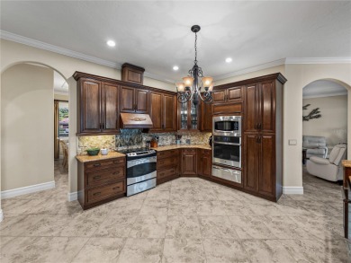 Discover your personal oasis in this stunning 4-bedroom on River Wilderness Golf and Country Club in Florida - for sale on GolfHomes.com, golf home, golf lot