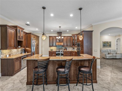 Discover your personal oasis in this stunning 4-bedroom on River Wilderness Golf and Country Club in Florida - for sale on GolfHomes.com, golf home, golf lot