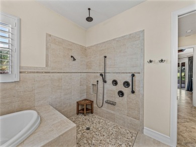 Discover your personal oasis in this stunning 4-bedroom on River Wilderness Golf and Country Club in Florida - for sale on GolfHomes.com, golf home, golf lot