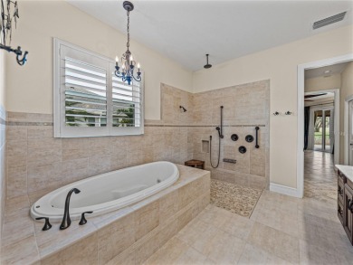 Discover your personal oasis in this stunning 4-bedroom on River Wilderness Golf and Country Club in Florida - for sale on GolfHomes.com, golf home, golf lot