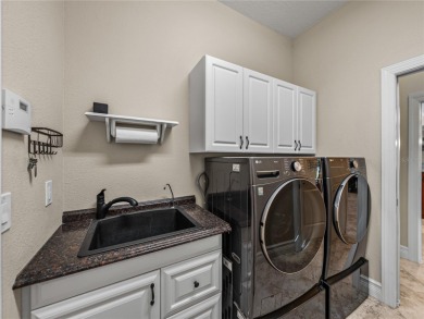 Discover your personal oasis in this stunning 4-bedroom on River Wilderness Golf and Country Club in Florida - for sale on GolfHomes.com, golf home, golf lot