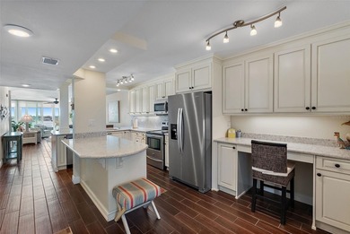 Straight from the pages of Coastal Living, this pristine on Isla Del Sol Yacht and Country Club in Florida - for sale on GolfHomes.com, golf home, golf lot