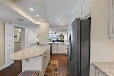 Straight from the pages of Coastal Living, this pristine on Isla Del Sol Yacht and Country Club in Florida - for sale on GolfHomes.com, golf home, golf lot