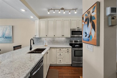 Straight from the pages of Coastal Living, this pristine on Isla Del Sol Yacht and Country Club in Florida - for sale on GolfHomes.com, golf home, golf lot