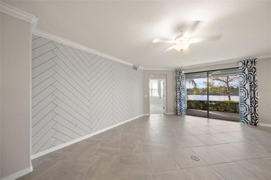 Please enjoy this beautifully upgraded first floor end unit on Sarasota National Golf Club in Florida - for sale on GolfHomes.com, golf home, golf lot