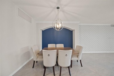 Please enjoy this beautifully upgraded first floor end unit on Sarasota National Golf Club in Florida - for sale on GolfHomes.com, golf home, golf lot