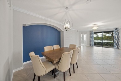 Please enjoy this beautifully upgraded first floor end unit on Sarasota National Golf Club in Florida - for sale on GolfHomes.com, golf home, golf lot