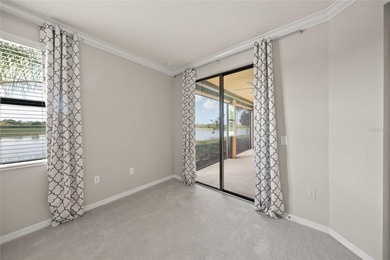 Please enjoy this beautifully upgraded first floor end unit on Sarasota National Golf Club in Florida - for sale on GolfHomes.com, golf home, golf lot