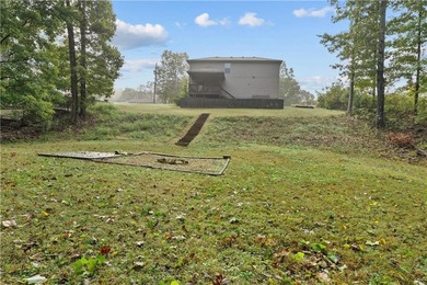 Welcome to this updated 1,480 square foot home in the wooded on Bella Vista - Metfield Golf Complex and Country Club in Arkansas - for sale on GolfHomes.com, golf home, golf lot