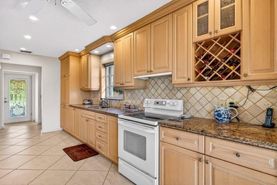 Beautiful villa with sweeping lake and golf course views on Quail Ridge Golf Course and Country Club in Florida - for sale on GolfHomes.com, golf home, golf lot