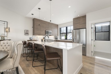 This luxurious townhome can be seen rising above the Granby on Headwaters Golf Course At Granby Ranch in Colorado - for sale on GolfHomes.com, golf home, golf lot