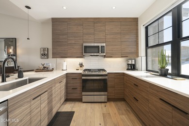 This luxurious townhome can be seen rising above the Granby on Headwaters Golf Course At Granby Ranch in Colorado - for sale on GolfHomes.com, golf home, golf lot