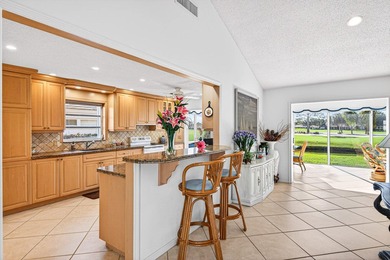 Beautiful villa with sweeping lake and golf course views on Quail Ridge Golf Course and Country Club in Florida - for sale on GolfHomes.com, golf home, golf lot