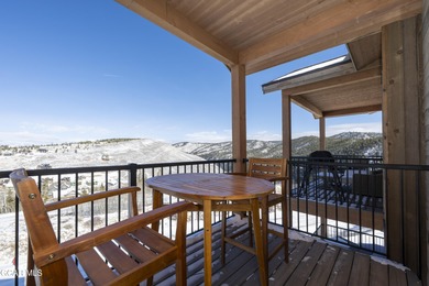 This luxurious townhome can be seen rising above the Granby on Headwaters Golf Course At Granby Ranch in Colorado - for sale on GolfHomes.com, golf home, golf lot